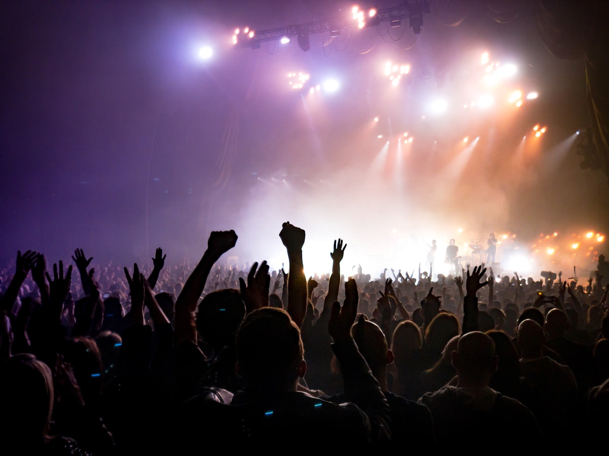 Energetic dancehall concert crowd at night — the raw energy that shatta drum kit production needs to capture