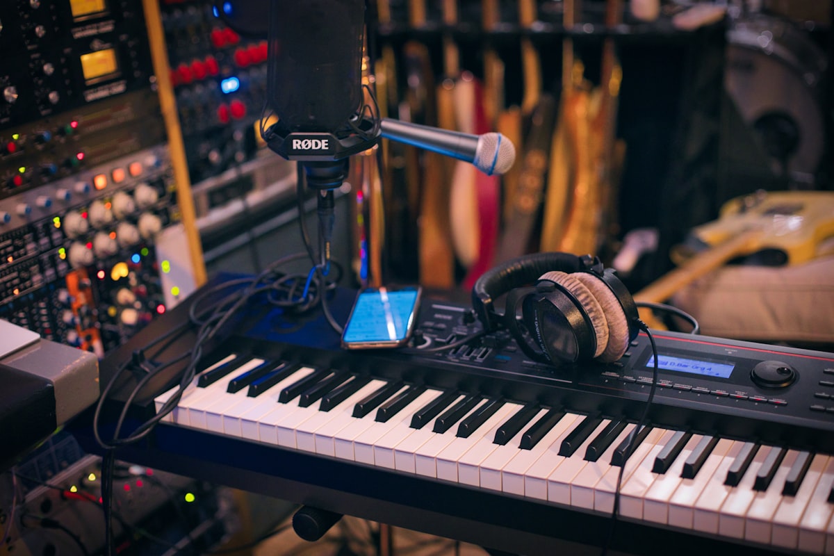 Music producer in studio working with Caribbean samples and bouyon drum kit in professional DAW setup